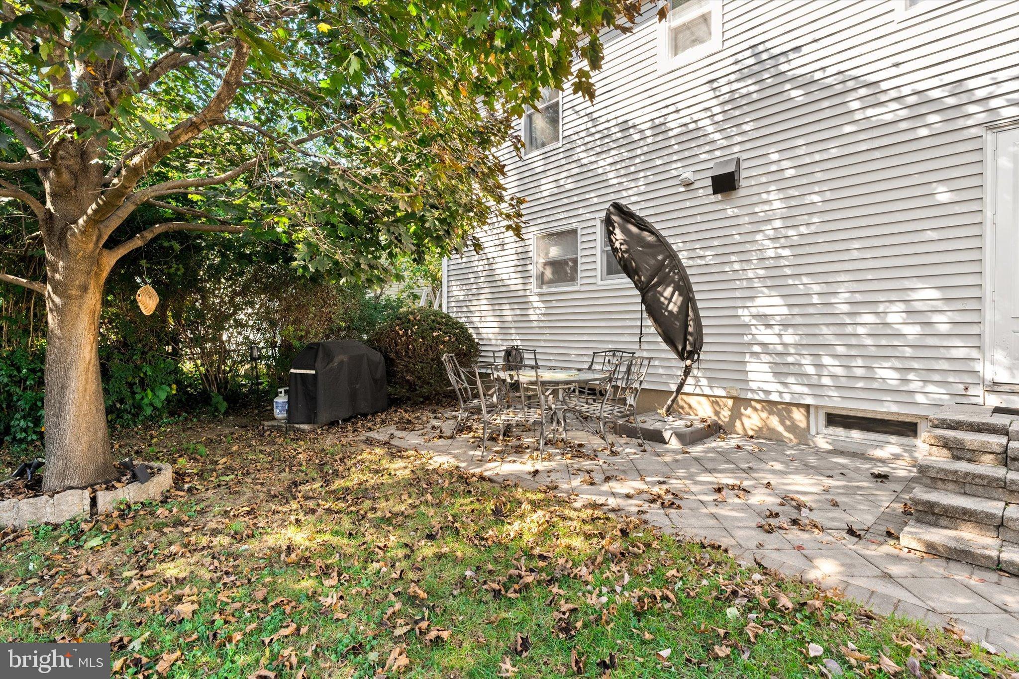 23 Beaumont Road Hamilton, NJ 08620 - Photo 32 of 45 a backyard of a house with table and chairs