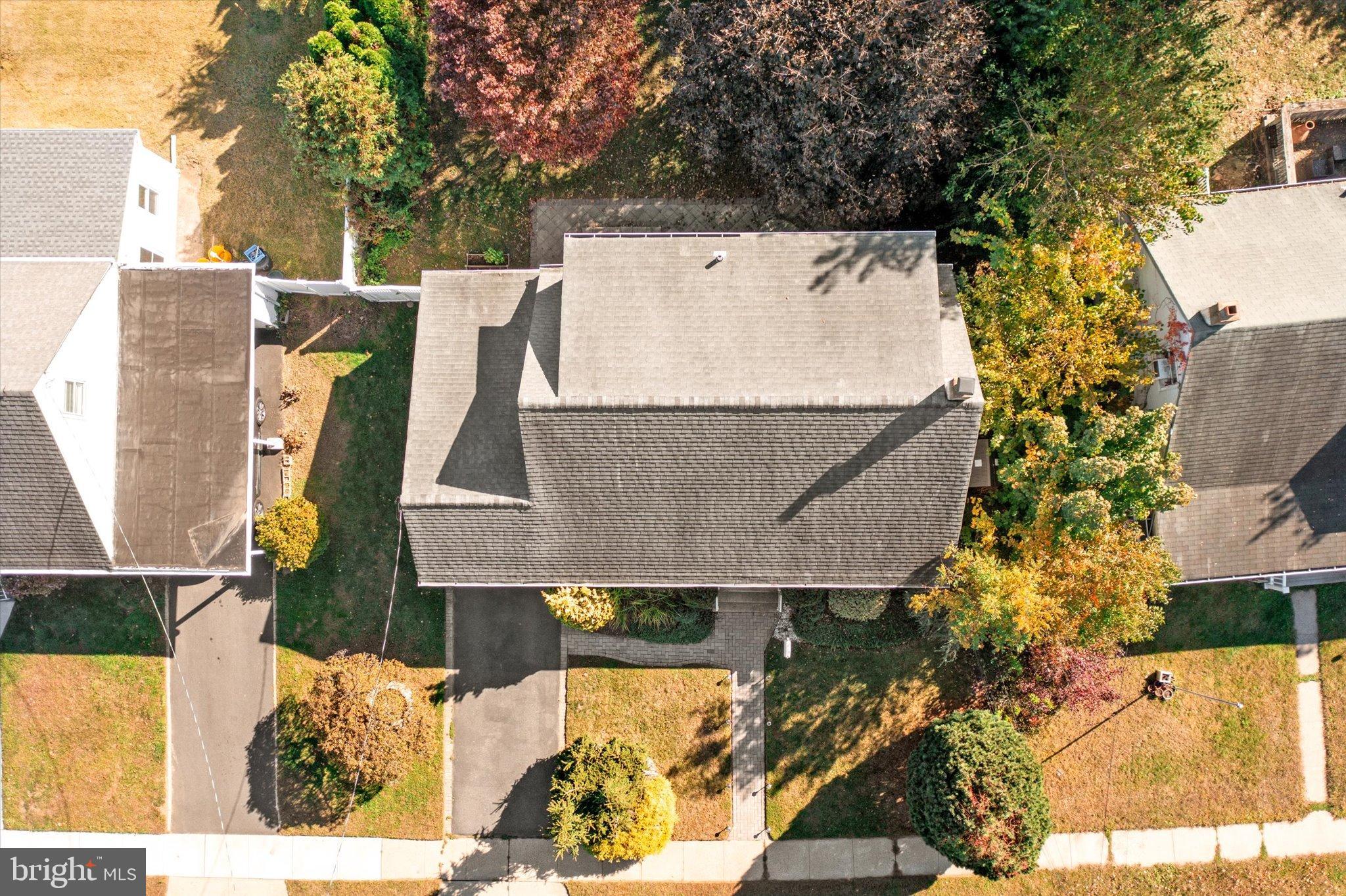 23 Beaumont Road Hamilton, NJ 08620 - Photo 5 of 45 an aerial view of a house with a yard and large trees