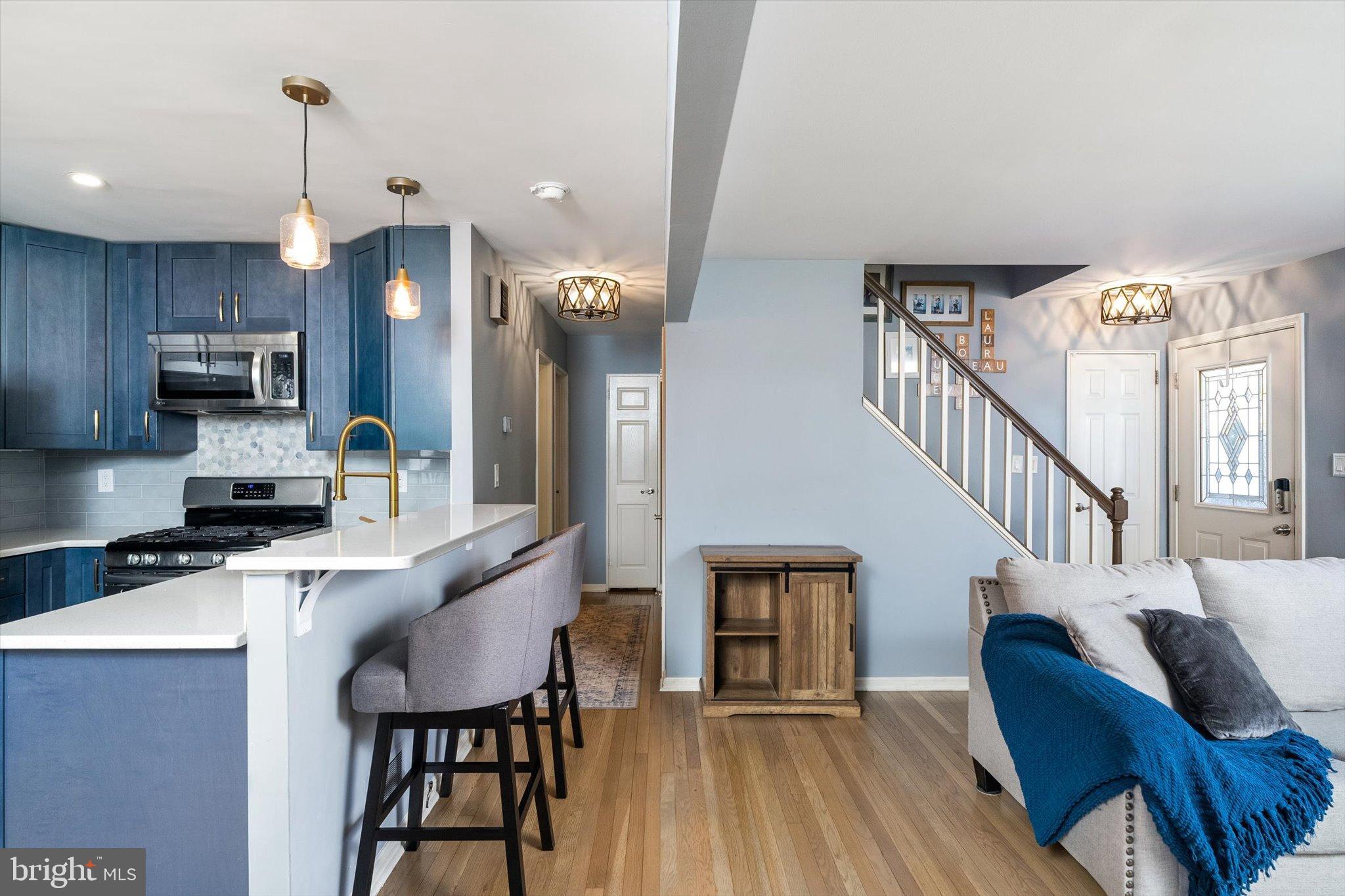 23 Beaumont Road Hamilton, NJ 08620 - Photo 10 of 45 a kitchen with stainless steel appliances kitchen island granite countertop a dining table chairs and a refrigerator