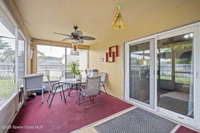 a room with furniture and a large window