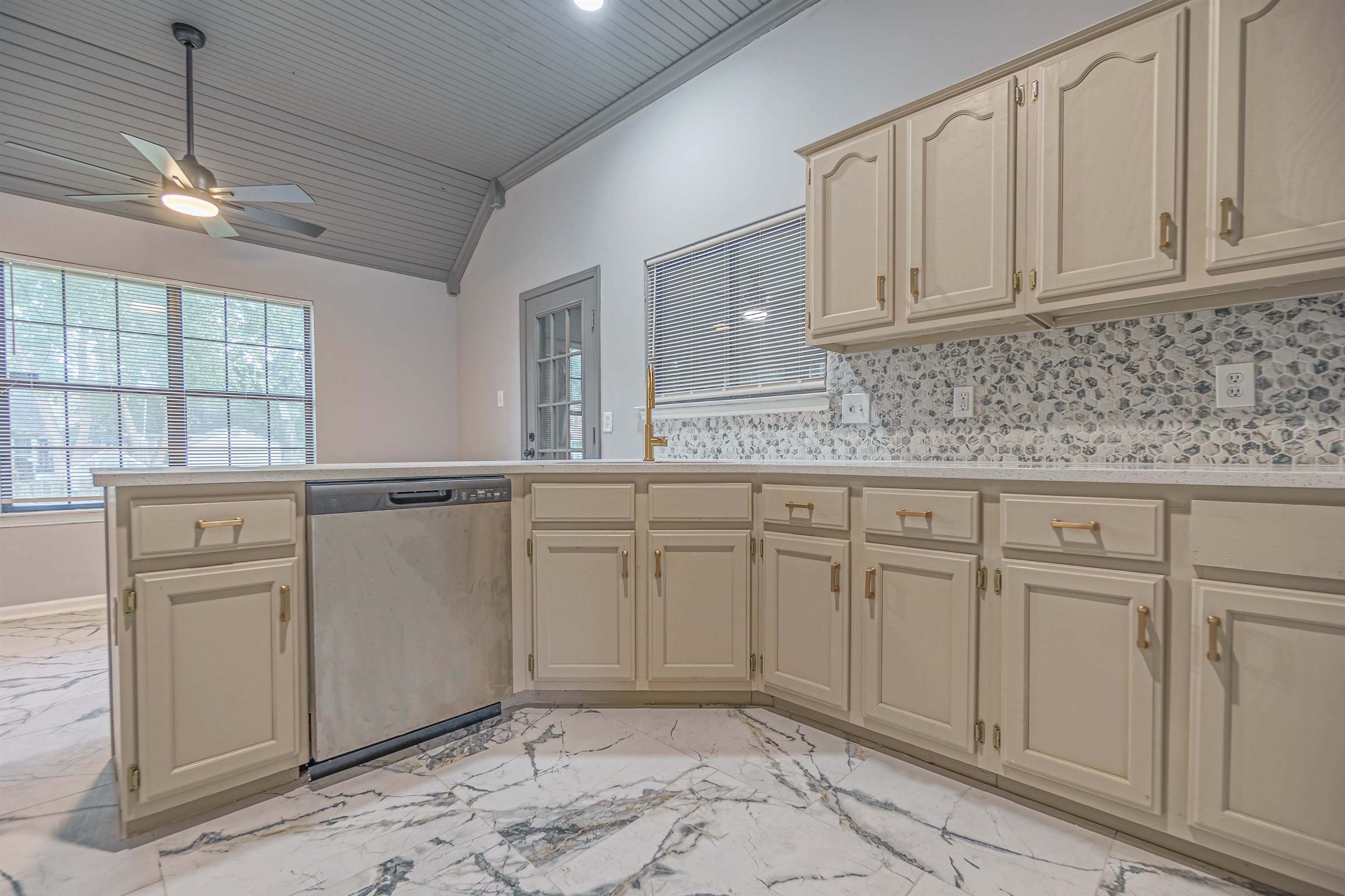 5406 Ross Road Memphis, TN 38141 - Photo 14 of 27 a kitchen with white cabinets and white appliances