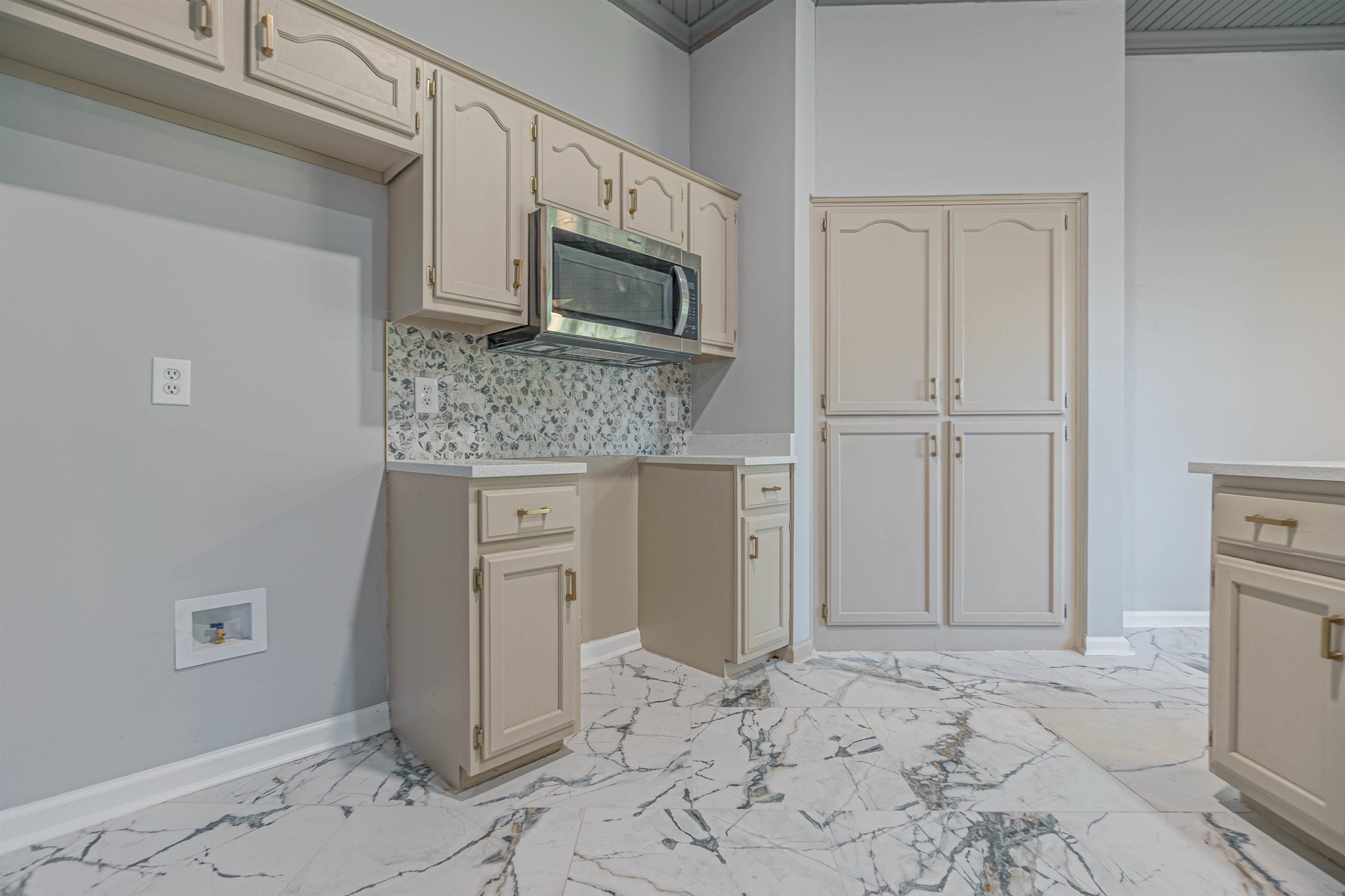 5406 Ross Road Memphis, TN 38141 - Photo 15 of 27 a bathroom with a granite countertop sink and a mirror
