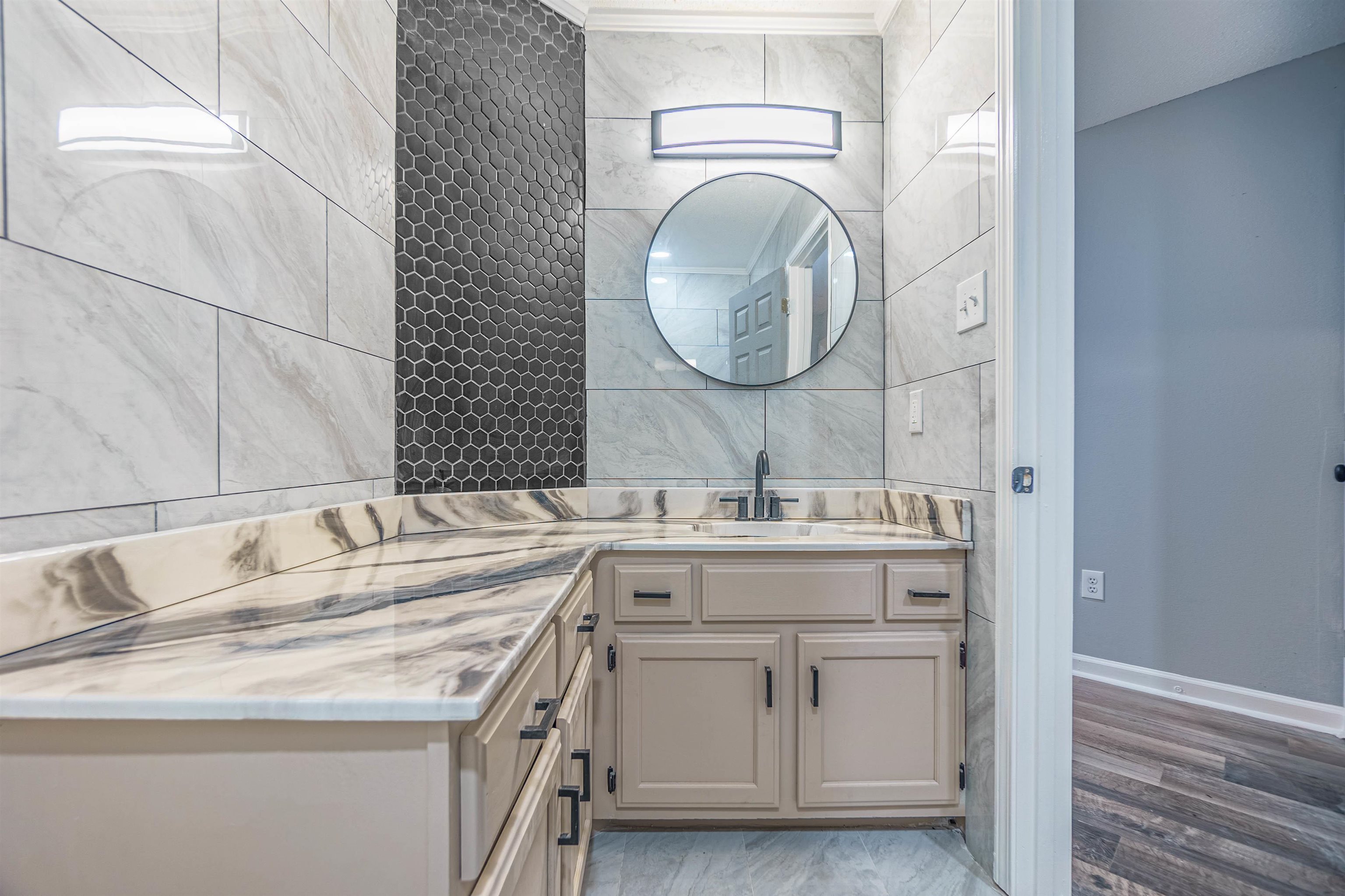 5406 Ross Road Memphis, TN 38141 - Photo 16 of 27 a bathroom with a sink and a mirror