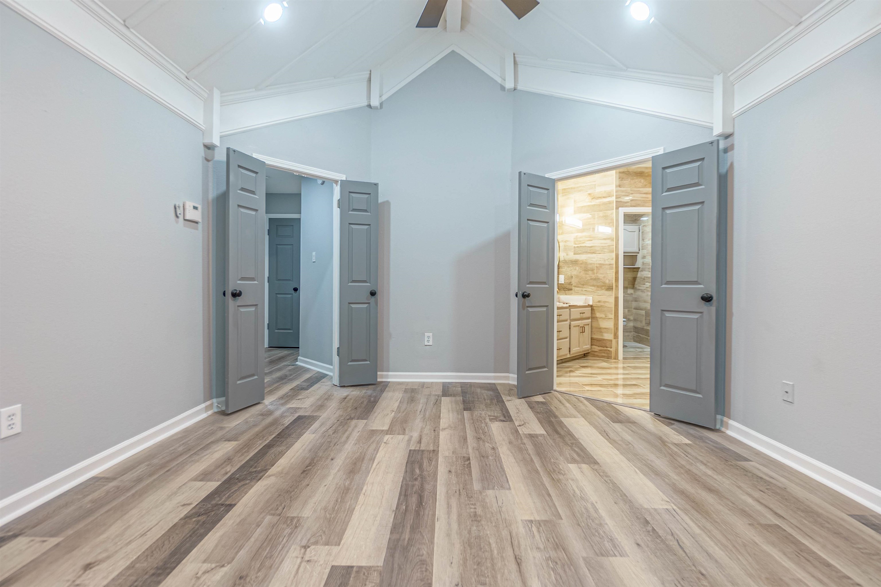 5406 Ross Road Memphis, TN 38141 - Photo 18 of 27 a view of an empty room with wooden floor and a window