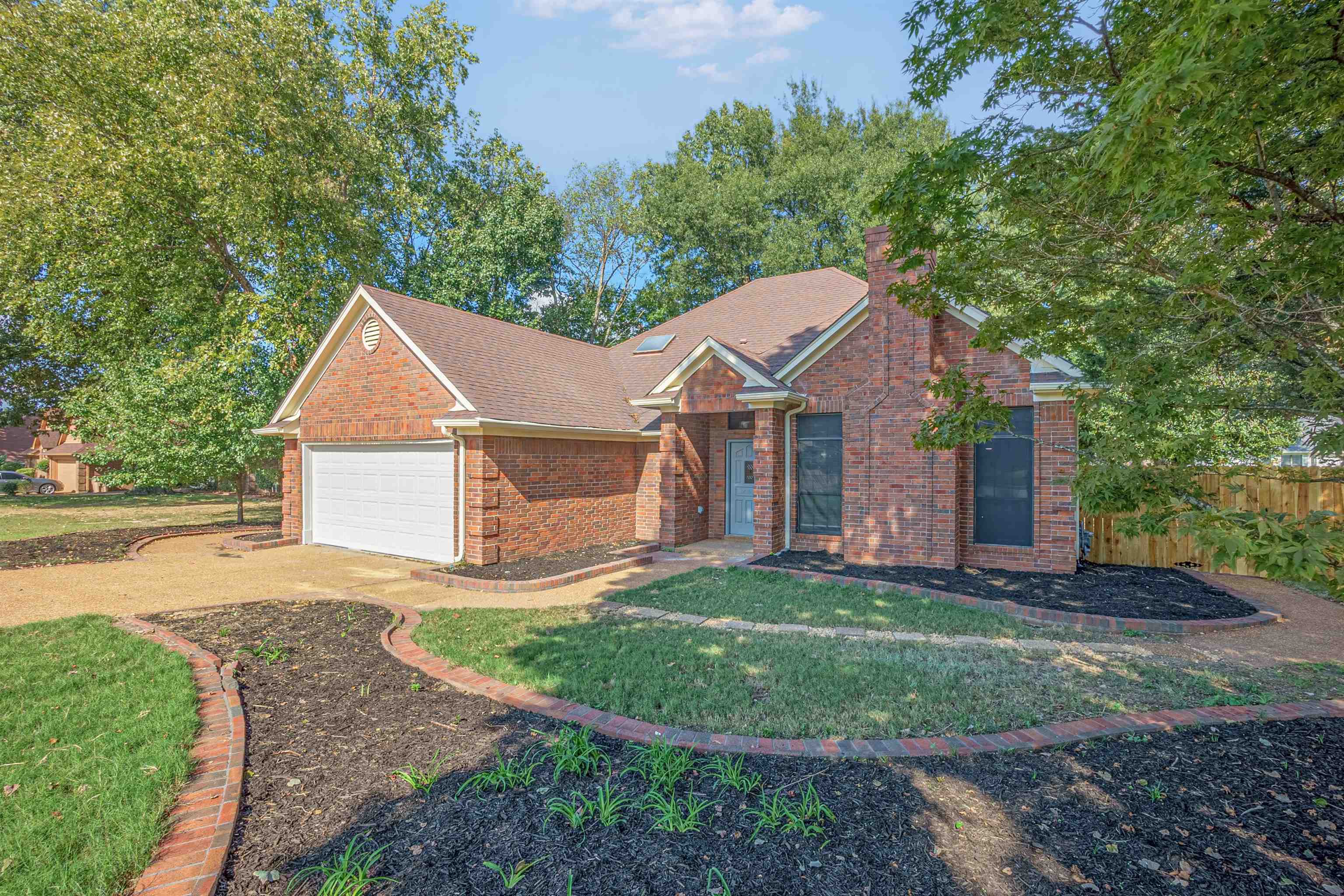 5406 Ross Road Memphis, TN 38141 - Photo 2 of 27 a view of a yard in front of a house with large trees