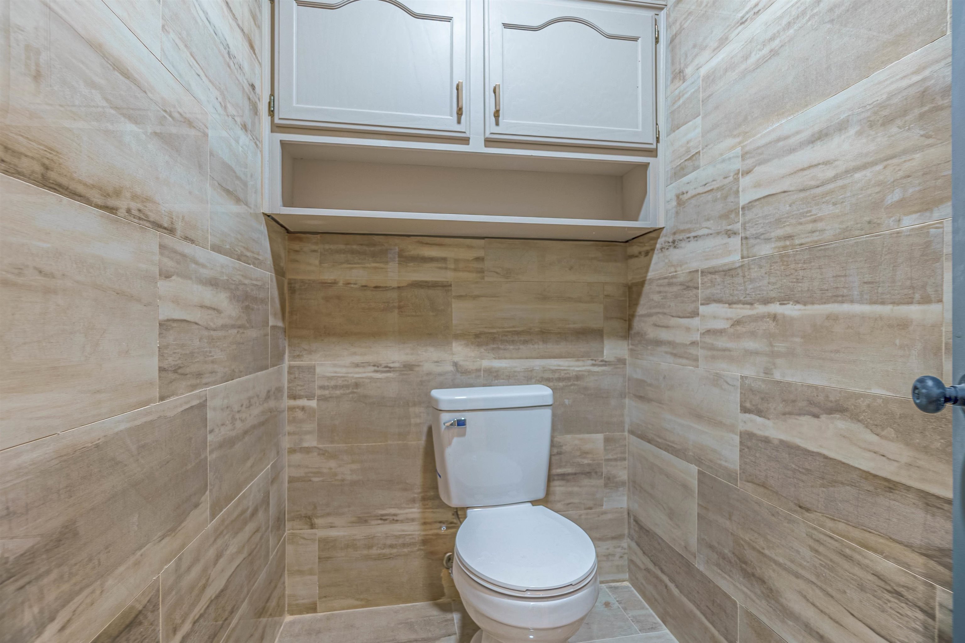 5406 Ross Road Memphis, TN 38141 - Photo 22 of 27 a bathroom with a toilet and a shower