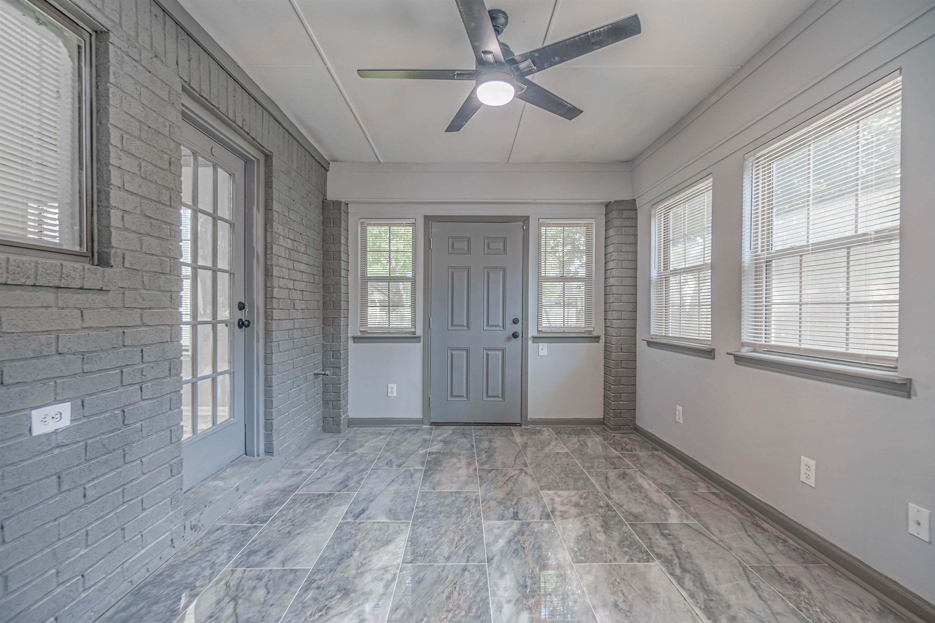 5406 Ross Road Memphis, TN 38141 - Photo 9 of 27 a view of empty room with wooden floor and fan