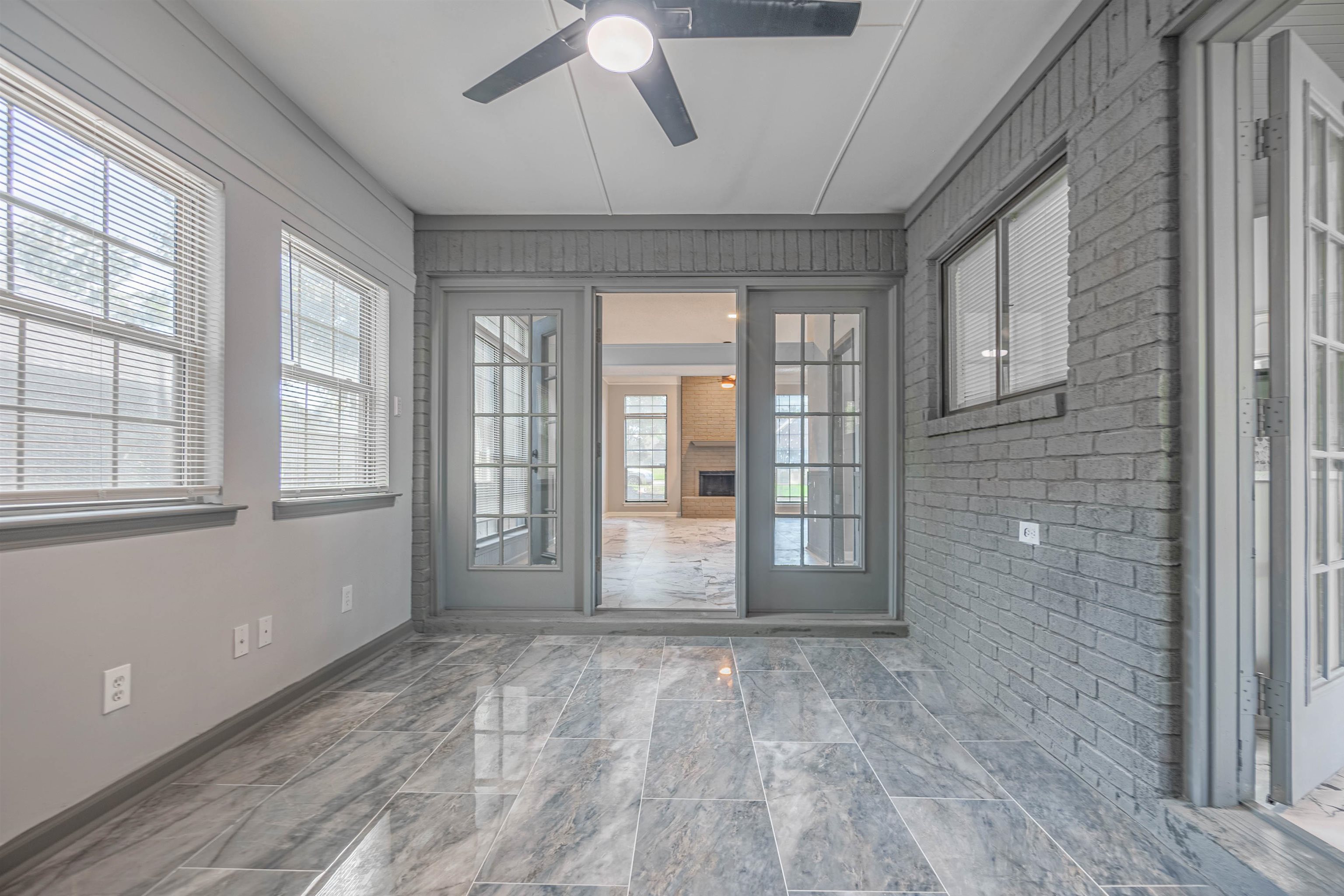 5406 Ross Road Memphis, TN 38141 - Photo 10 of 27 a view of an empty room with wooden floor and fan