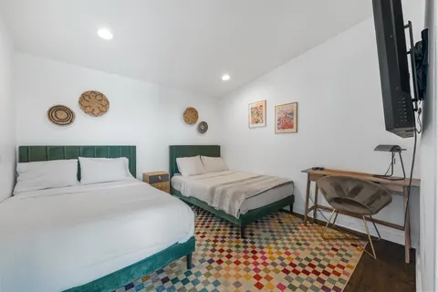 a bed room with a bed and a window