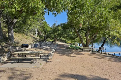 a view of a green field with wooden fence