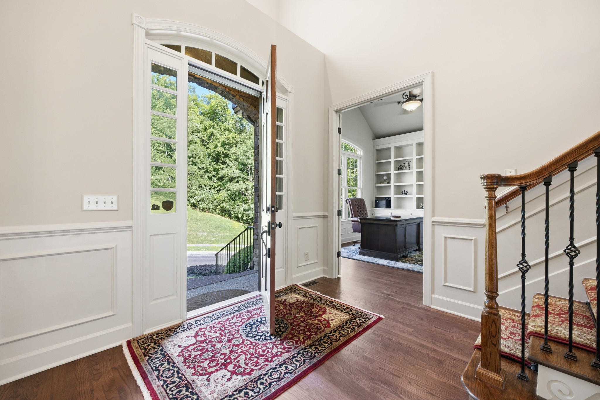 319 Hamlets End Way Franklin, TN 37067 - Photo 8 of 54 a living room with hardwood floor and a rug