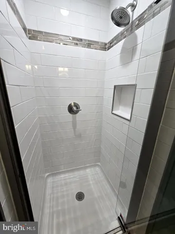 a spacious bedroom with a bed and a couch