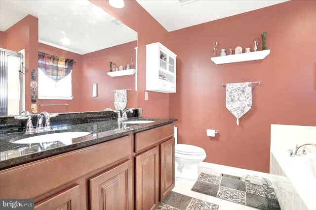 a bathroom with a tub and a window