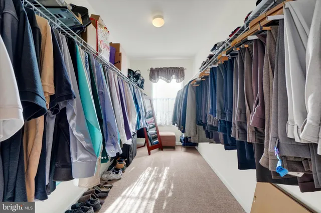 a bed room with a bed and a window