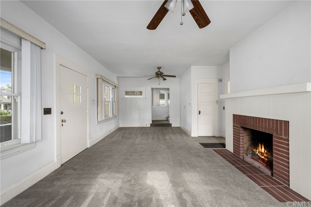 633 East Maple Avenue Orange, CA 92866 - Photo 12 of 51 a view of empty room with fireplace and wooden floor