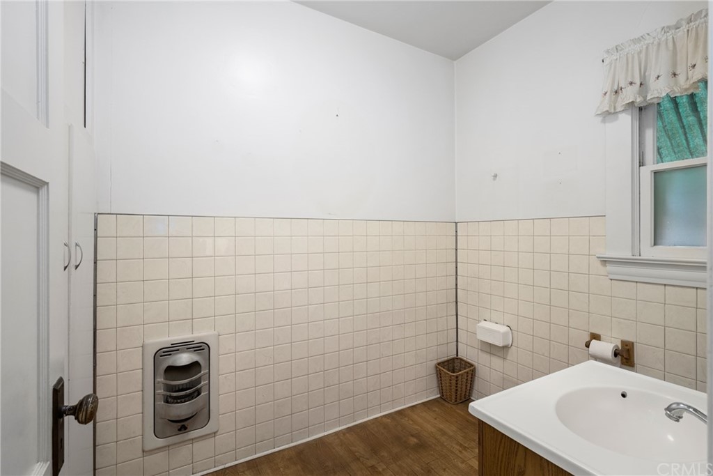 633 East Maple Avenue Orange, CA 92866 - Photo 22 of 51 a bathroom with a sink and a shower