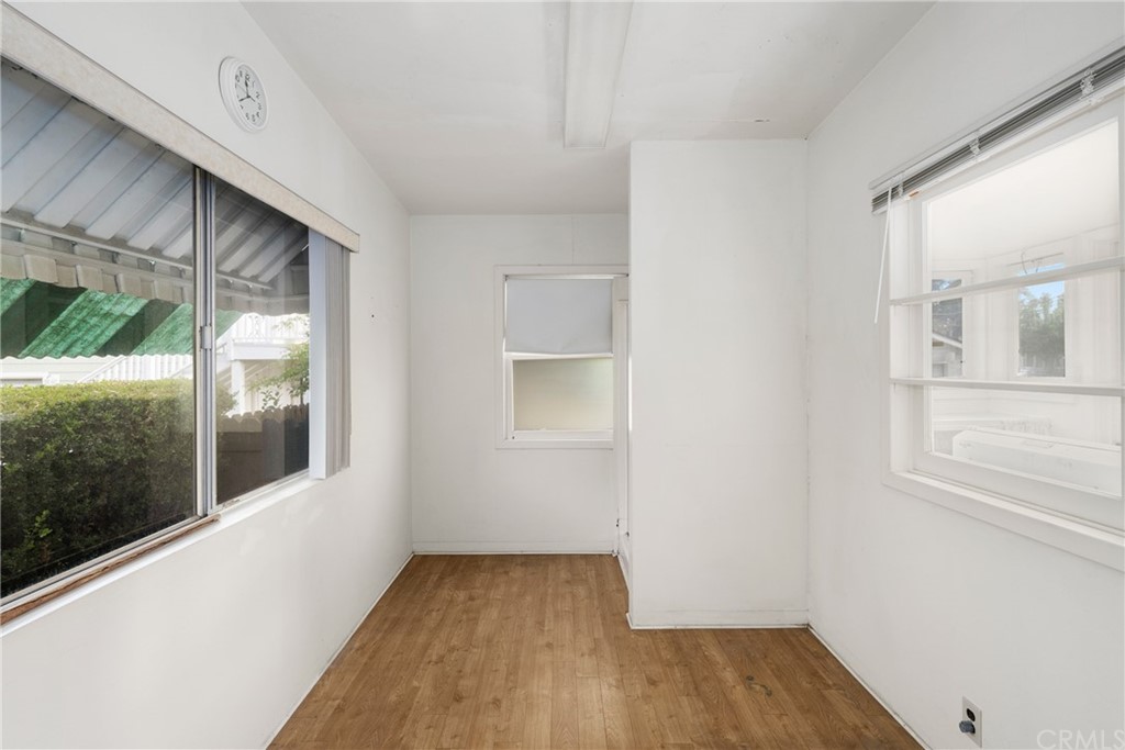 633 East Maple Avenue Orange, CA 92866 - Photo 24 of 51 a view of an empty room with wooden floor and a window