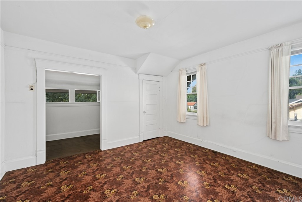 633 East Maple Avenue Orange, CA 92866 - Photo 29 of 51 a bedroom with a bed and a window