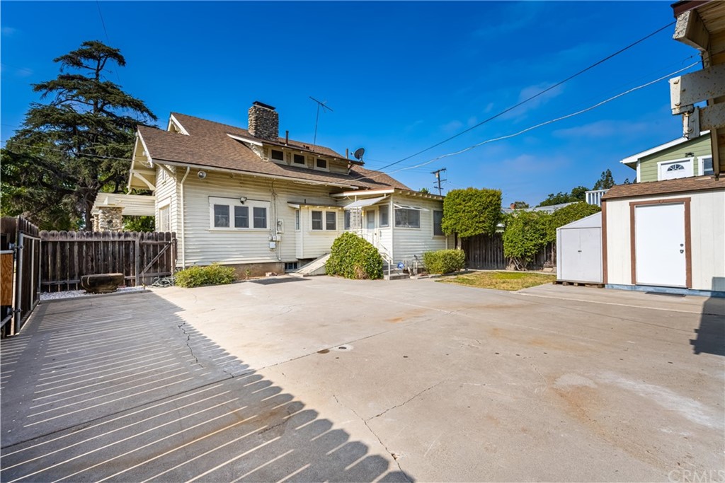 633 East Maple Avenue Orange, CA 92866 - Photo 33 of 51 a front view of a house with a yard