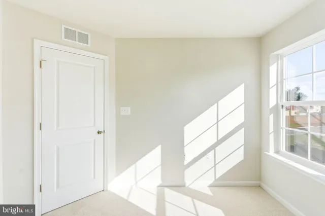 a view of empty room with windows