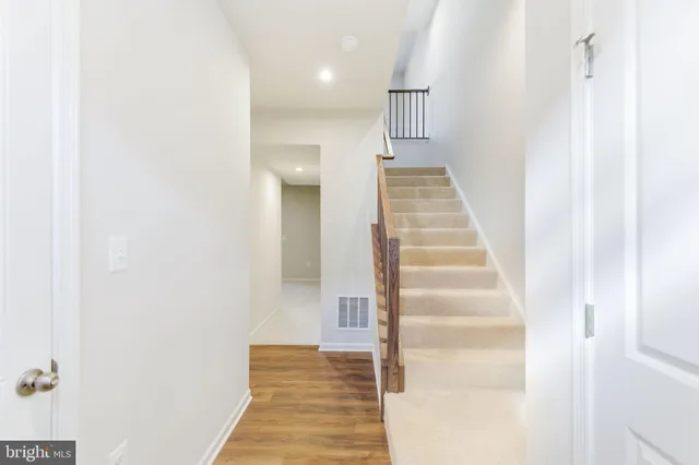 a view of staircase with white walls