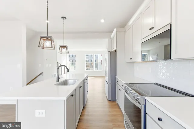a kitchen with a sink and stove