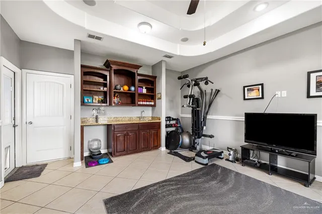 a view of a livingroom with workspace and a window