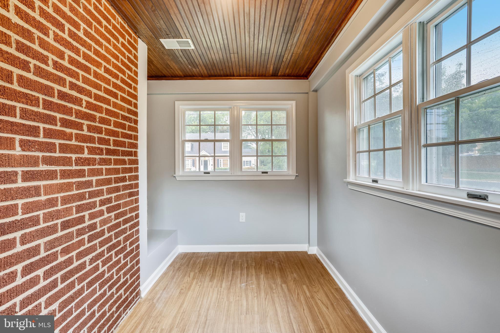 1815 Myrtle Road Silver Spring, MD 20902 - Photo 13 of 33 Den with brick exposed wall