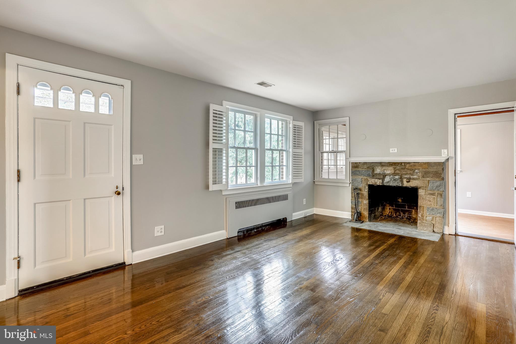 1815 Myrtle Road Silver Spring, MD 20902 - Photo 5 of 33 Living Room with wood burning stone fireplace