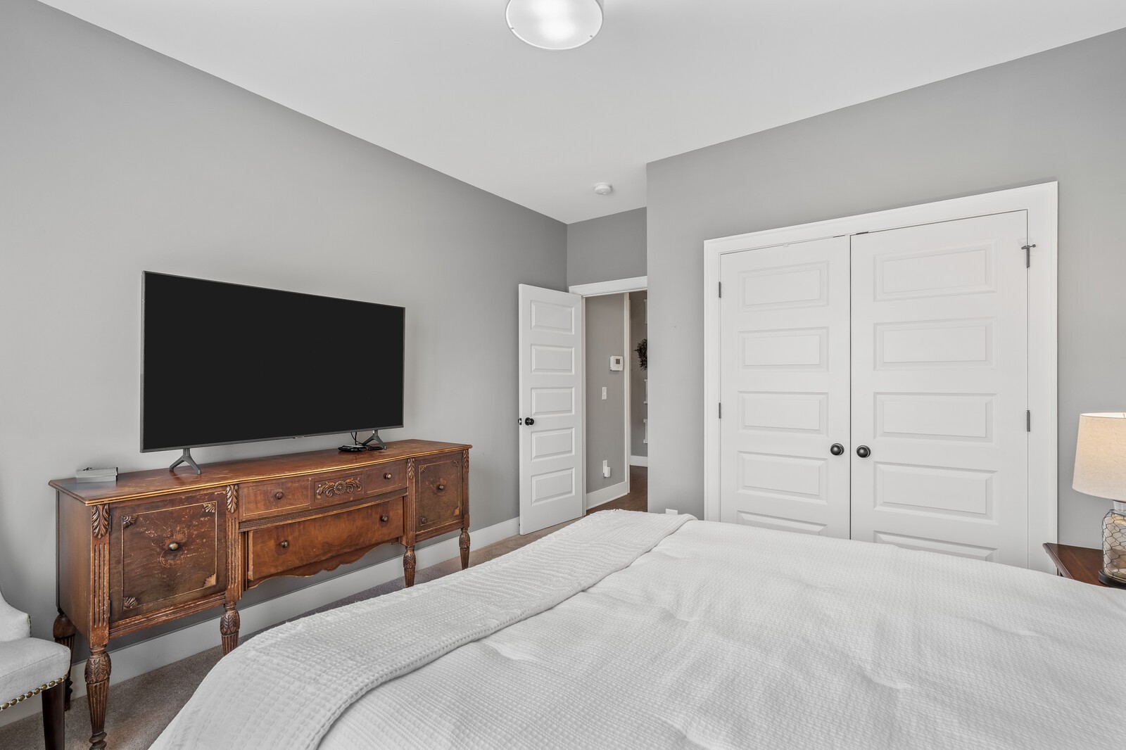 1036 Beamon Drive Franklin, TN 37064 - Photo 14 of 57 a bedroom with a bed and a flat screen tv