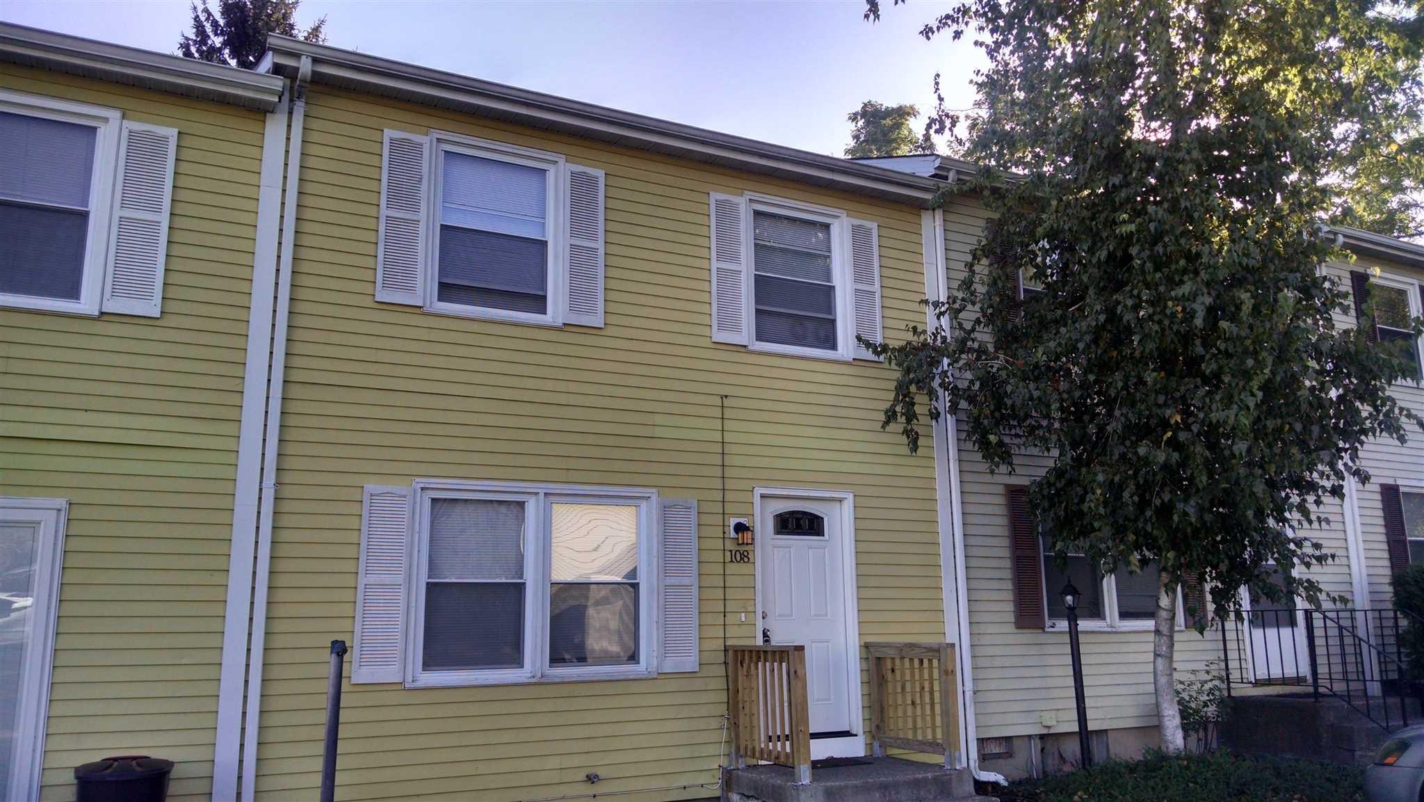 108 Rinaldi Boulevard Poughkeepsie, NY 12601 - Photo 1 of 1 a view of a house with wooden fence and large trees