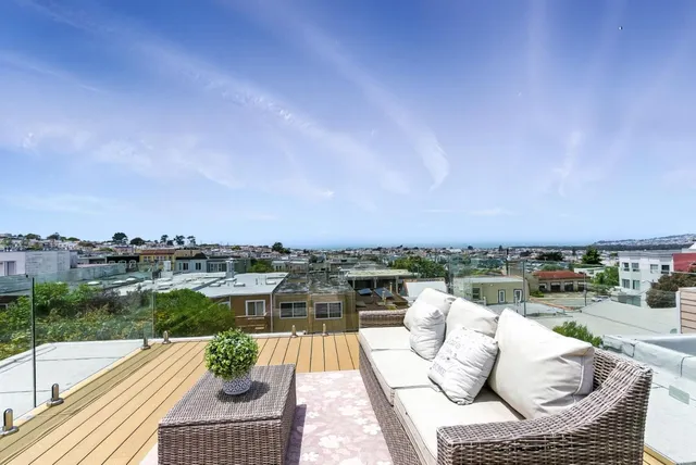 a view of roof deck with patio
