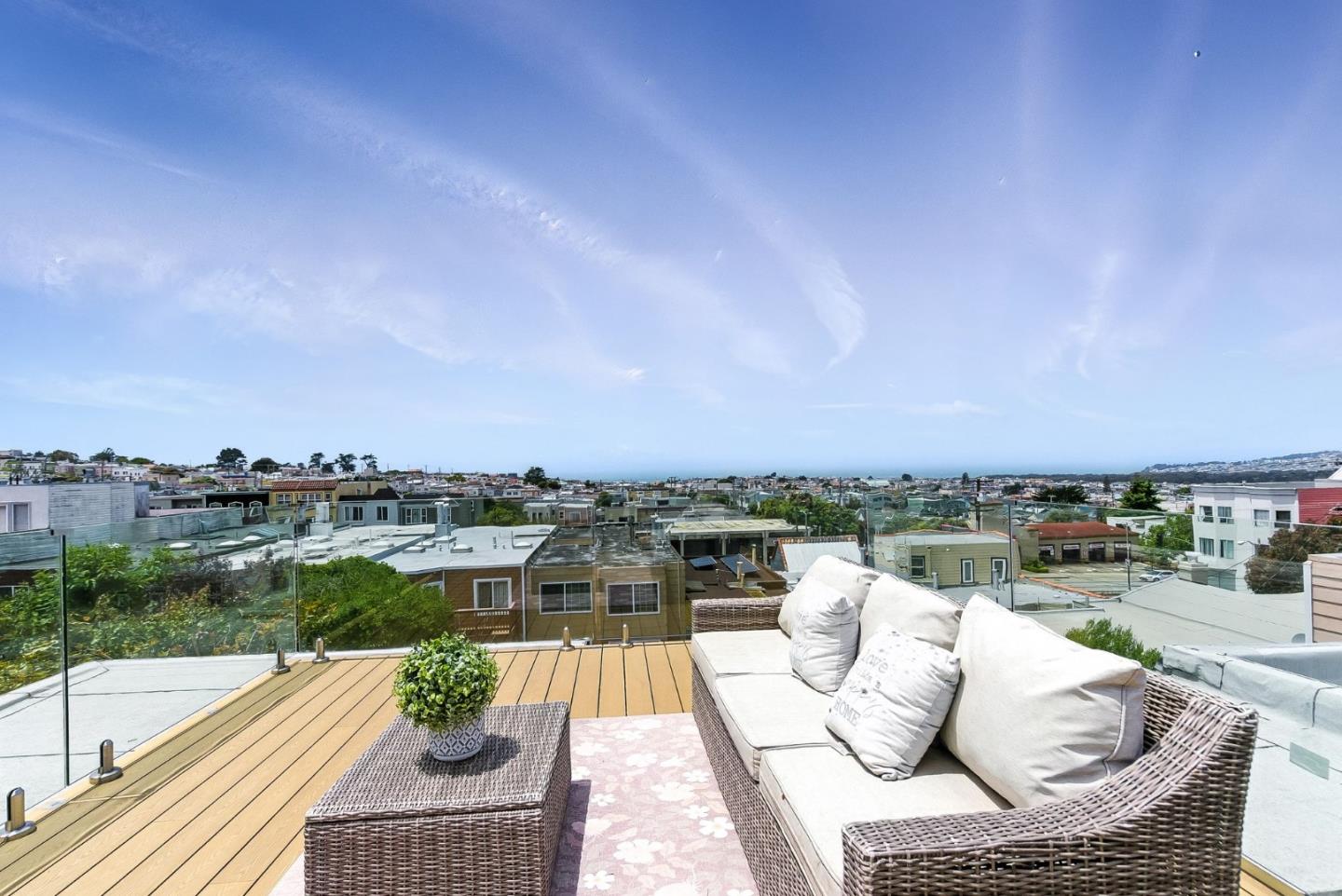 a view of roof deck with patio