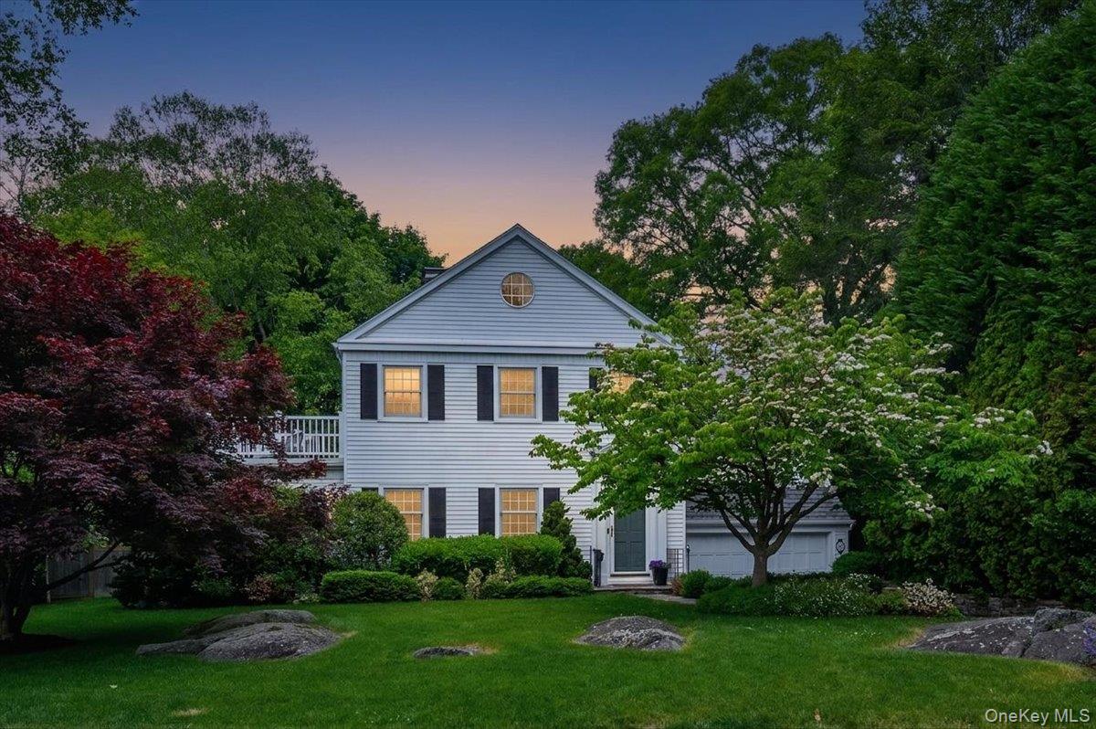49 Eton Road Larchmont, NY 10538 - Photo 30 of 34 a front view of a house with a yard