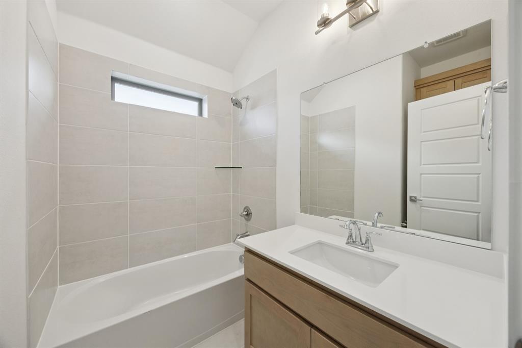1904 Palmetto Road Celina, TX 75009 - Photo 20 of 32 a bathroom with a sink and a mirror