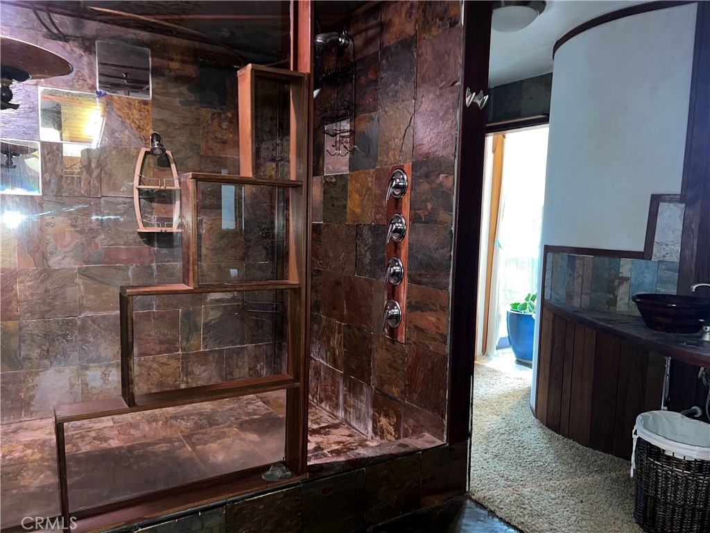 9400 McKinley Road Kelseyville, CA 95451 - Photo 14 of 31 a bathroom with a glass shower door