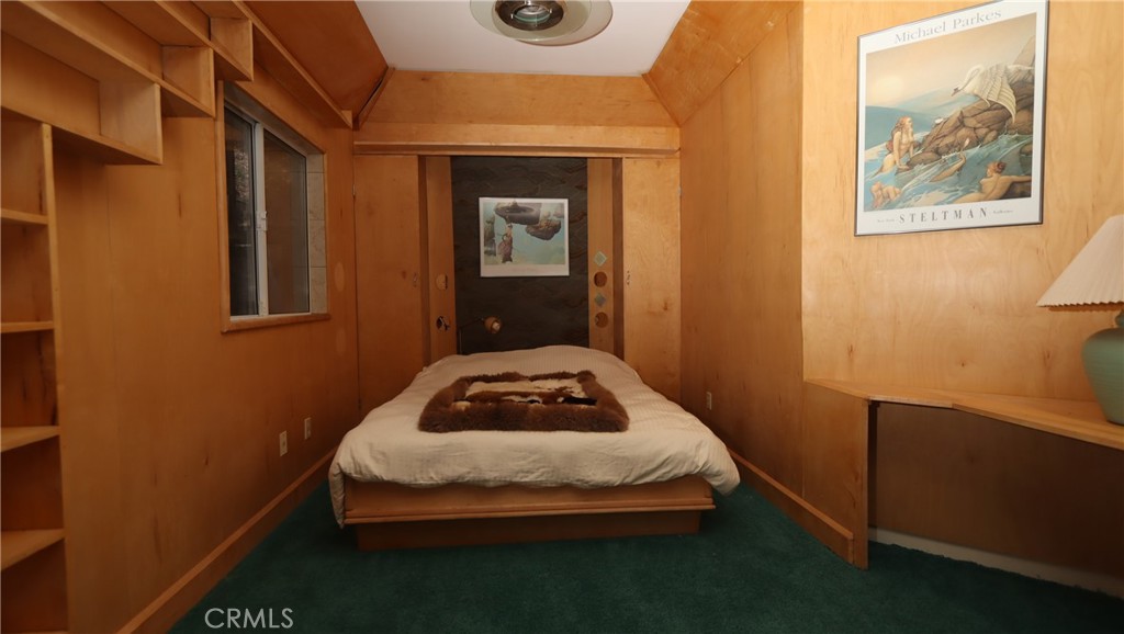 9400 McKinley Road Kelseyville, CA 95451 - Photo 16 of 31 a bedroom with a bed and wall painting