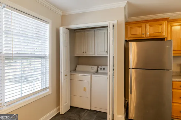 a view of kitchen with utility and a window