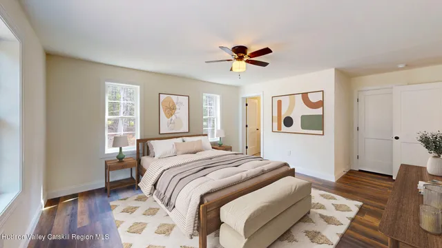 a bedroom with a large bed and a window