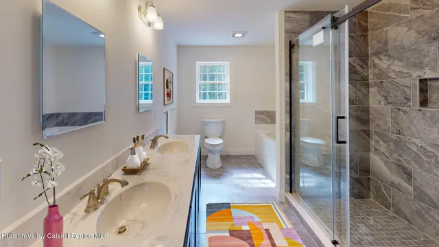 a bathroom with a tub sink and toilet