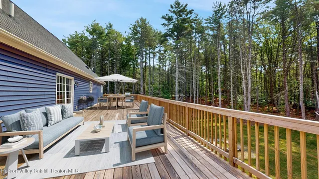 a view of balcony with furniture and trees
