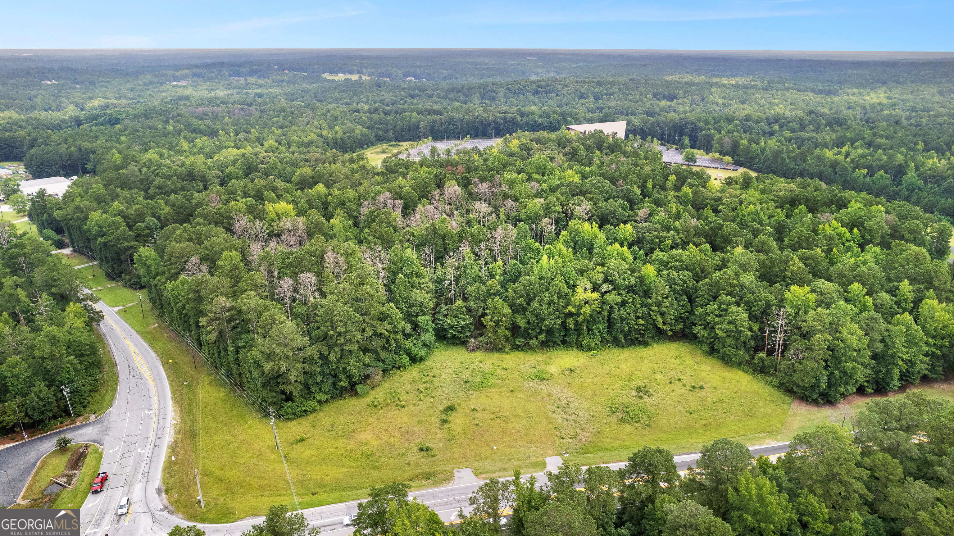 0 Poplar Road Sharpsburg, GA 30277 - Photo 9 of 16 a view of a lake with a yard