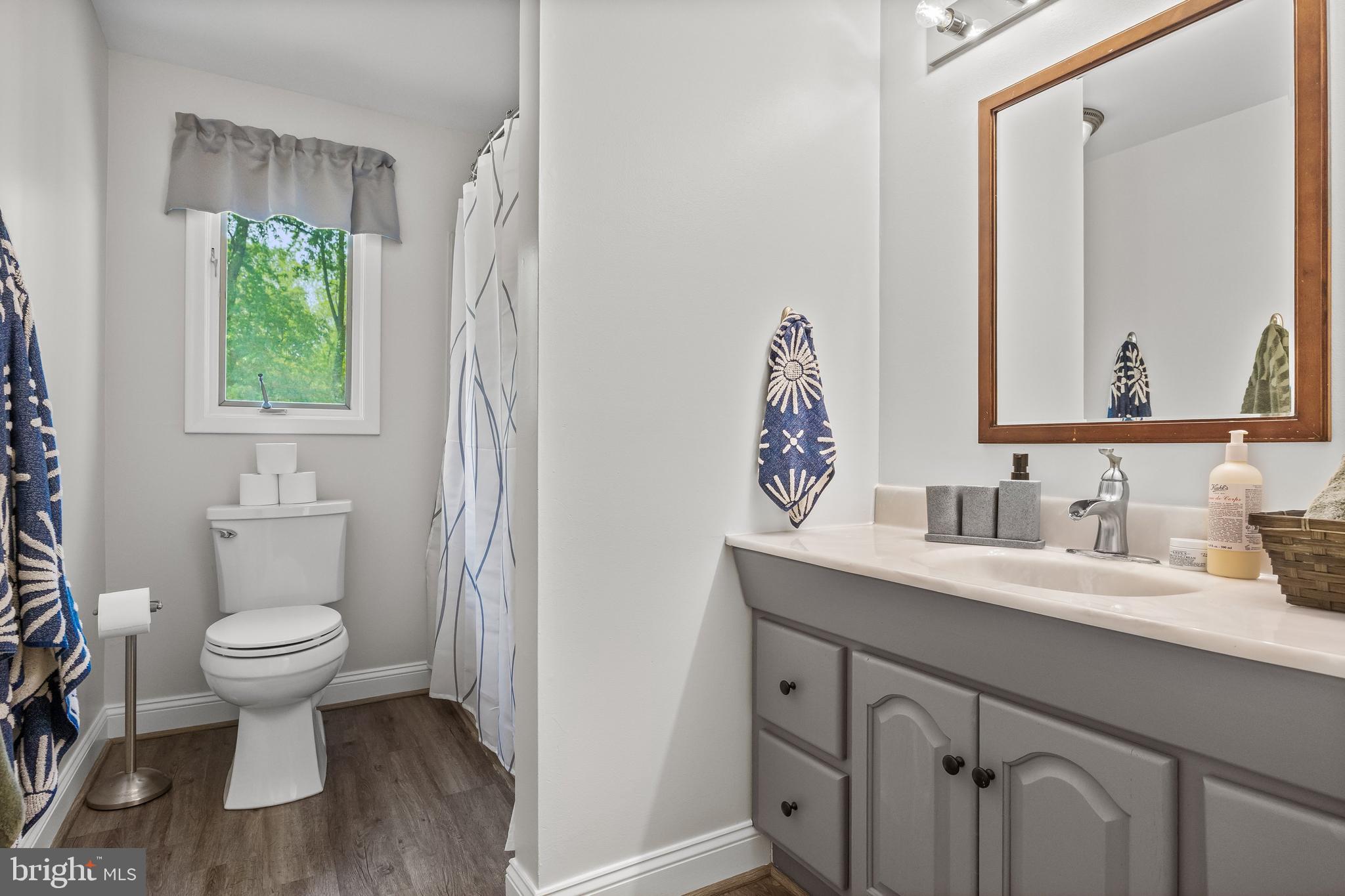 205 Hamilton Road Marlton, NJ 08053 - Photo 13 of 21 a bathroom with a sink toilet a mirror and a window