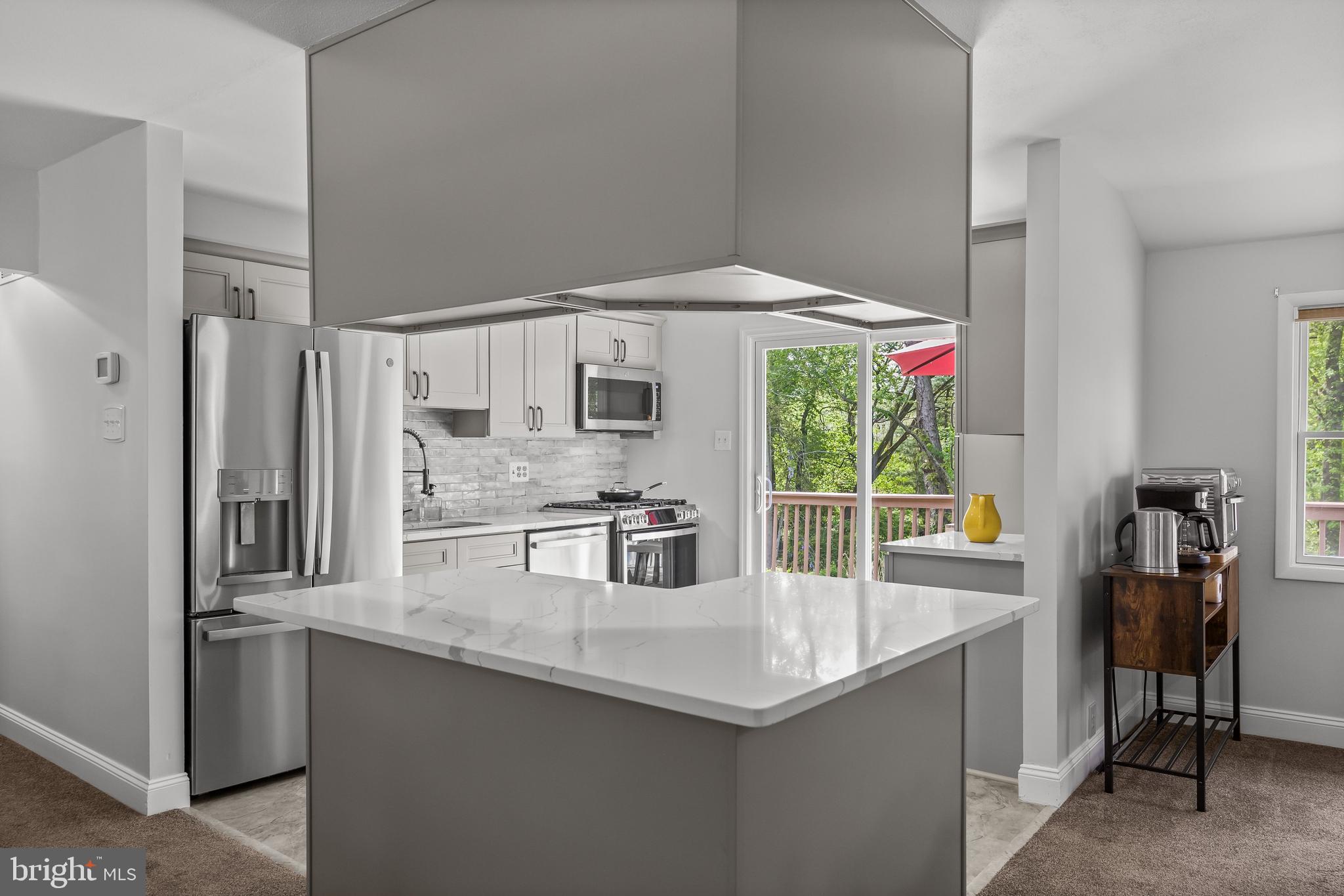 205 Hamilton Road Marlton, NJ 08053 - Photo 7 of 21 a kitchen with stainless steel appliances granite countertop a sink and a refrigerator