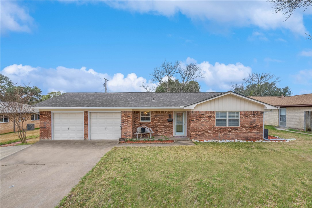 3802 Kelli Lane Bryan, TX 77802 - Photo 1 of 1 a view of a house with a garden and yard