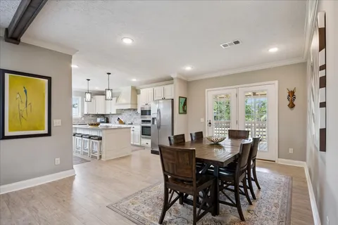 a kitchen with a table and chairs in it