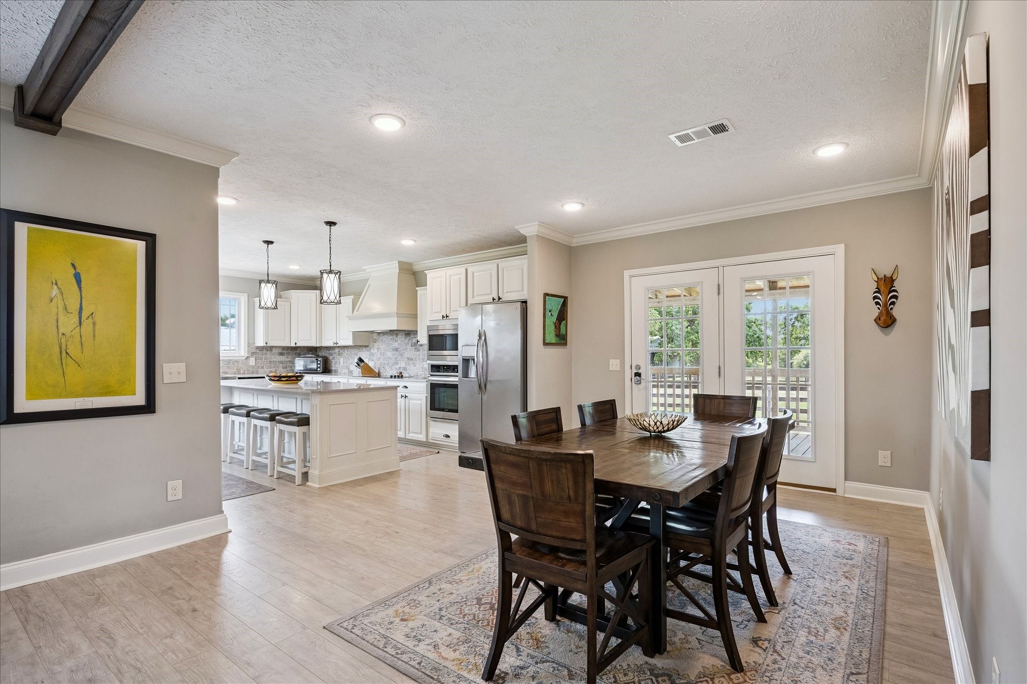 15946 Farm To Market Road 1094 Cat Spring, TX 78933 - Photo 13 of 50 a kitchen with a table and chairs in it
