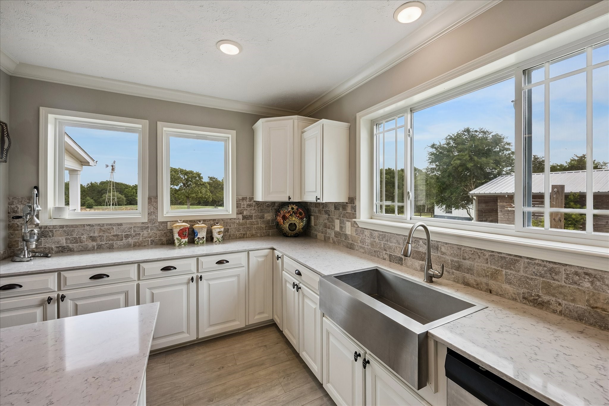 15946 Farm To Market Road 1094 Cat Spring, TX 78933 - Photo 16 of 50 a kitchen with a sink stove and cabinets