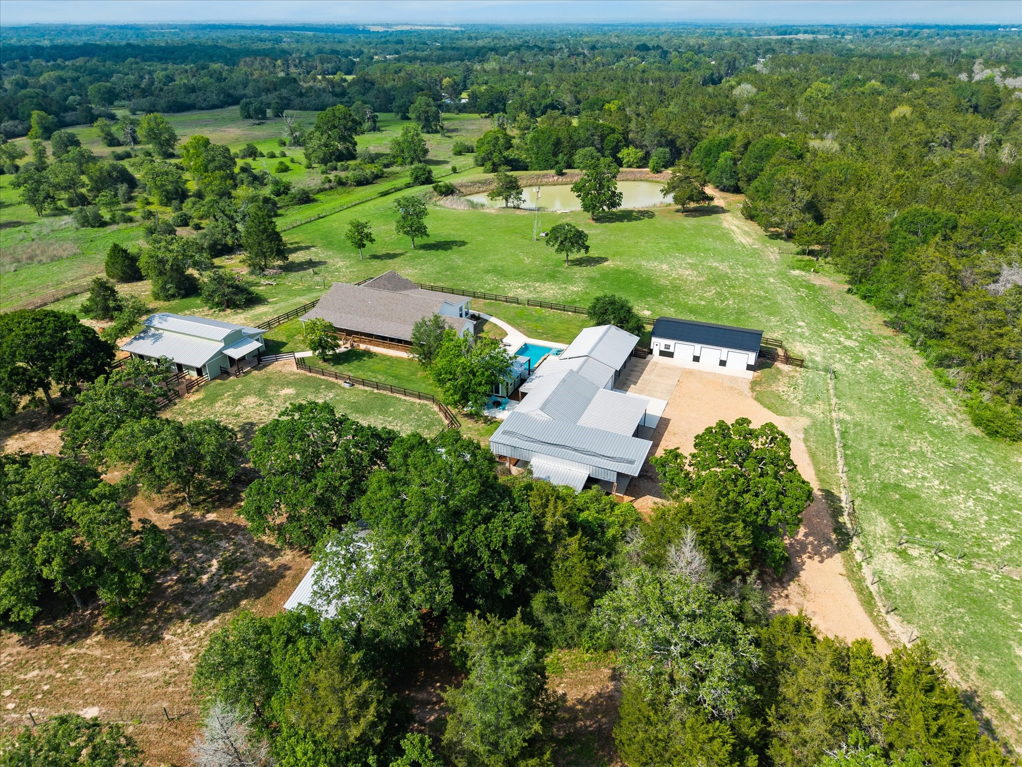15946 Farm To Market Road 1094 Cat Spring, TX 78933 - Photo 2 of 50 an aerial view of residential houses with outdoor space and trees