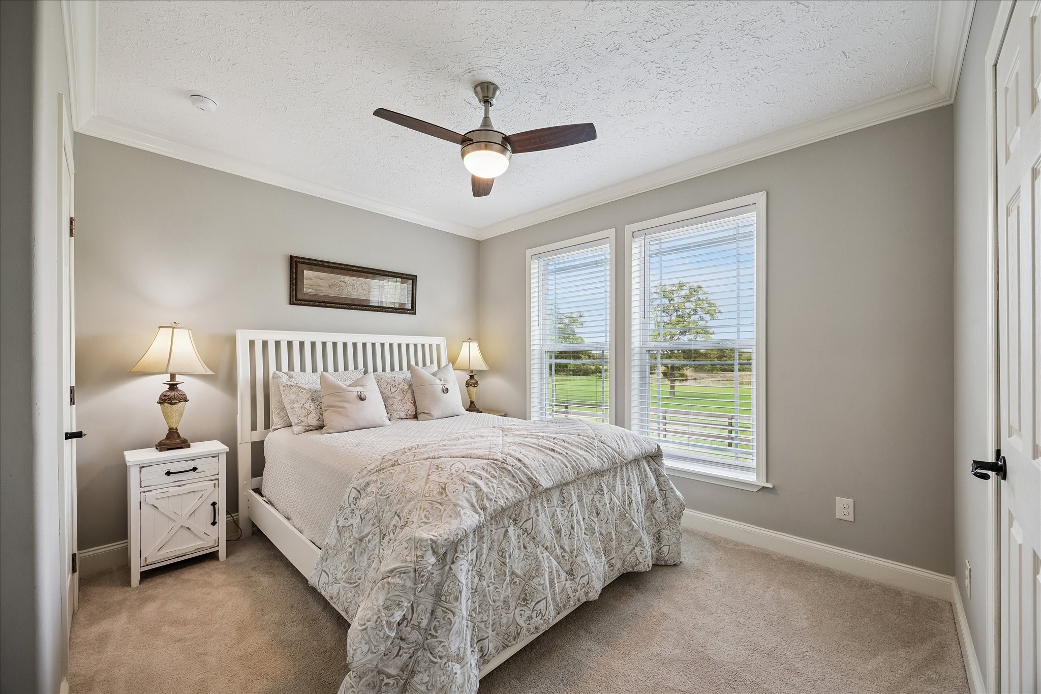 15946 Farm To Market Road 1094 Cat Spring, TX 78933 - Photo 21 of 50 a bedroom with a bed and a window